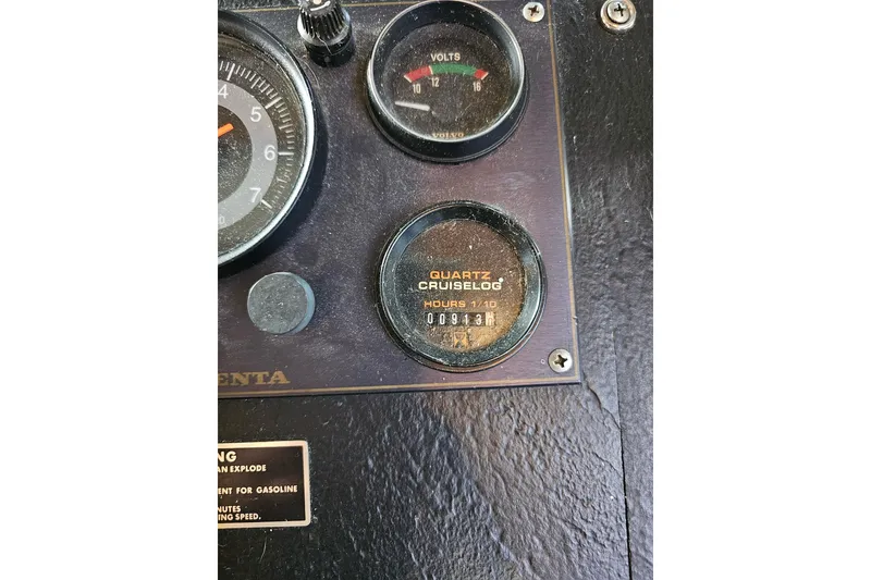 Slide: The Image of Close-up of 1985 Sumerset 14x60 boat dashboard with gauges and warning label. - 33