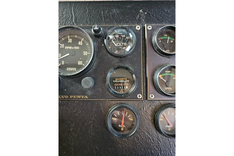 Slide: The Image of Control panel of a 1985 Sumerset 14x60 houseboat with various gauges. - 34