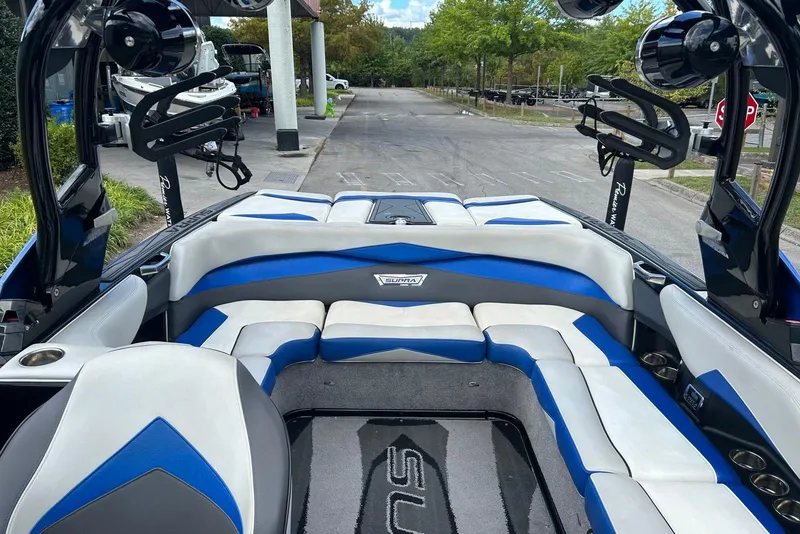 Slide: The Image of Interior of a 2014 Supra SA 450 boat with blue and white seating. - 14