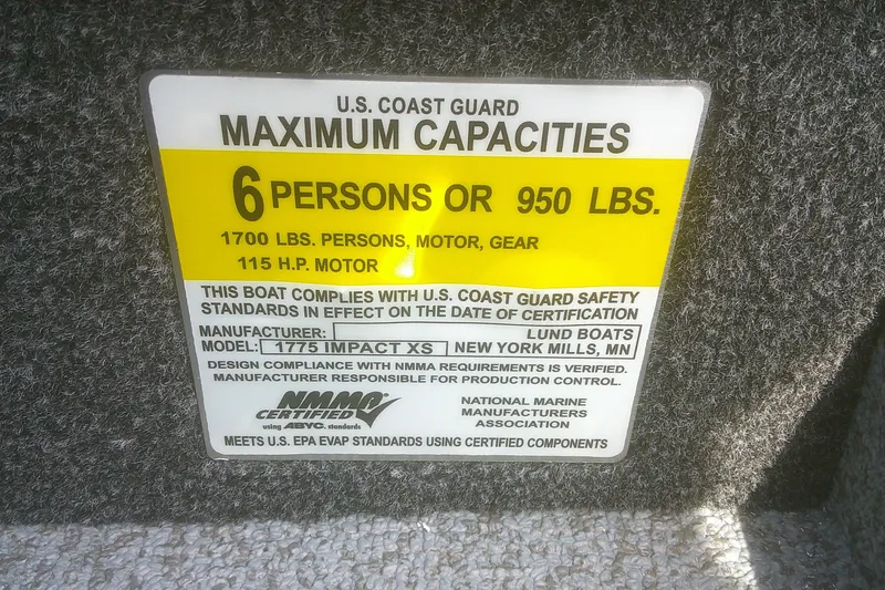 Slide: The Image of 2026 Lund 1775 Impact XS SS capacity label, 6 persons or 950 lbs, USCG certified. - 7