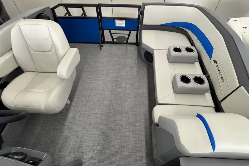 Slide: The Image of Interior of 2026 Starcraft GX 18 R boat with white seating and cup holders. - 11