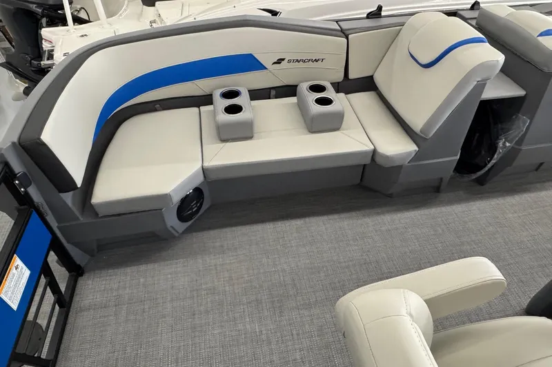 Slide: The Image of 2026 Starcraft GX 18 R boat interior with gray and blue seating, cup holders. - 12