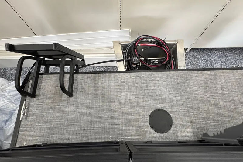 Slide: The Image of 2026 Starcraft GX 18 R boat interior with storage compartment and wiring. - 14