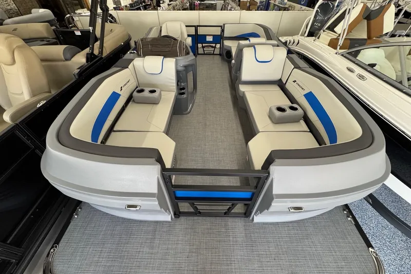 Slide: The Image of 2026 Starcraft GX 18 R boat interior with gray and blue seating, cup holders, and modern design. - 3