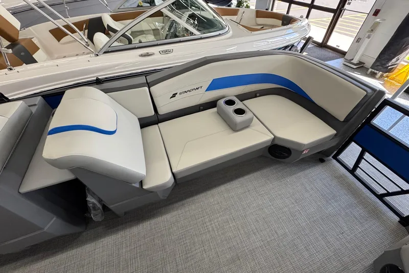 Slide: The Image of 2026 Starcraft GX 18 R boat interior with sleek seating and cup holders. - 7