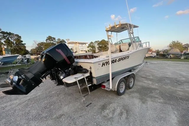 Slide: The Image of 1989 Hydra-Sports 2500WA boat on trailer, parked outdoors under clear sky. - 3