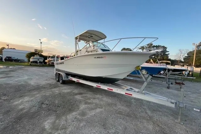 Slide: The Image of 1989 Hydra-Sports 2500WA boat on trailer, parked outdoors at sunset. - 4