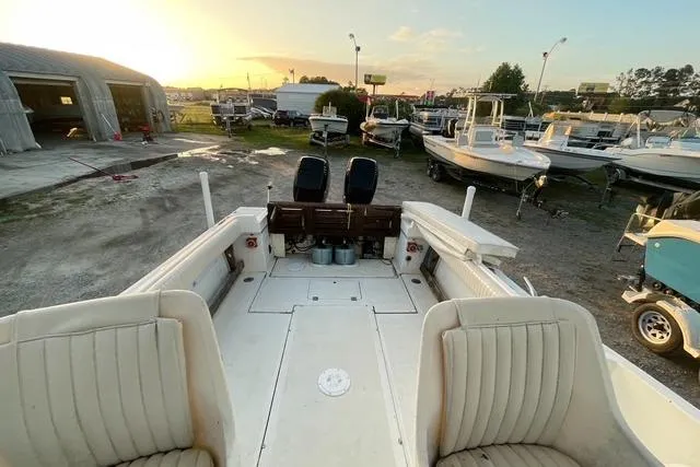 Slide: The Image of 1989 Hydra-Sports 2500WA boat interior at sunset in a marina setting. - 7