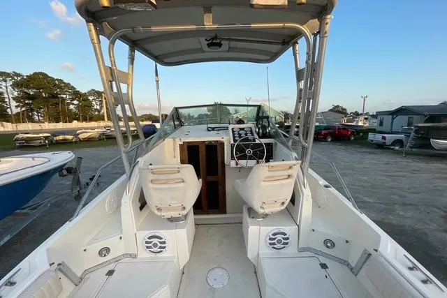 Slide: The Image of 1989 Hydra-Sports 2500WA boat interior with dual seats and steering console. - 8