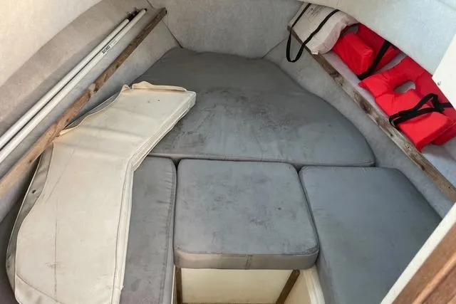 Slide: The Image of 1989 Hydra-Sports 2500WA cabin interior with cushions and life jackets. - 9
