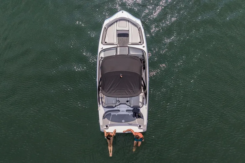 Slide: The Image of Manufacturer Provided Image: Overhead view of 2026 Yamaha Boats AR190 on water with two people swimming. - 4
