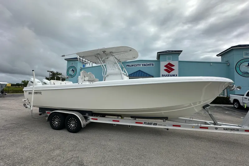 The Image of 2026 Bluewater 2850 boat on trailer at Palm City Yachts dealership. - 1