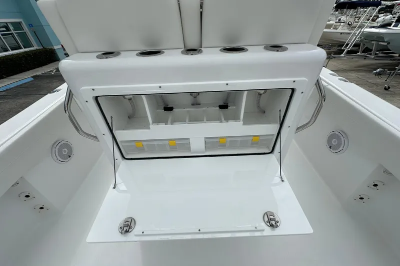 Slide: The Image of 2026 Bluewater 2850 boat storage compartment with open hatch, showcasing interior organization. - 19