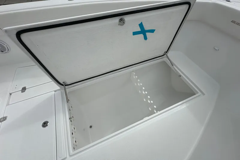 Slide: The Image of Open storage compartment on 2026 Bluewater 2850 boat, featuring a spacious interior. - 9