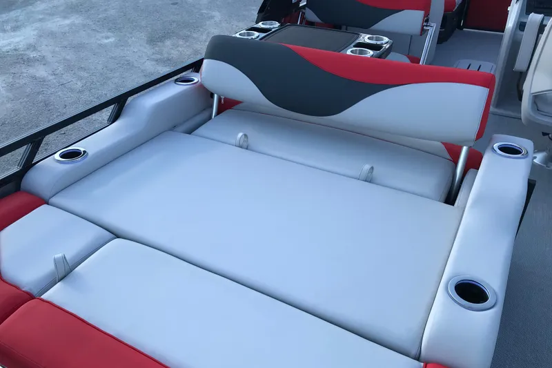 Slide: The Image of Red and gray seating with a table on a 2026 Avalon LSZ Entertainer boat. - 20