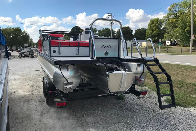 Slide: The Image of 2026 Avalon LSZ ENTERTAINER pontoon boat on trailer at dealership. - 3