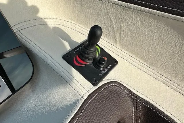 Slide: The Image of Joystick control on 2026 Regal LS6 boat's leather interior. - 10