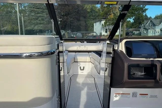 Slide: The Image of Interior view of 2026 Regal LS6 boat, featuring sleek seating and modern dashboard. - 18