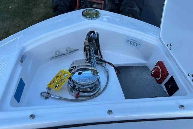Slide: The Image of Anchor compartment of 2026 Regal LS6 boat with winch and safety equipment. - 21