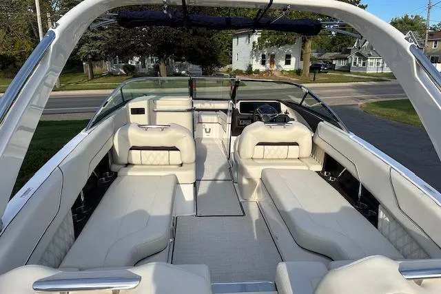 Slide: The Image of 2026 Regal LS6 boat with spacious white leather seating and modern design. - 4