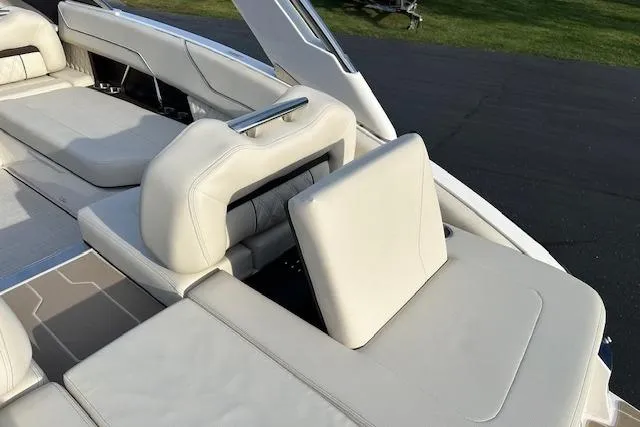 Slide: The Image of 2026 Regal LS6 boat interior with luxurious white seating and sleek design. - 5