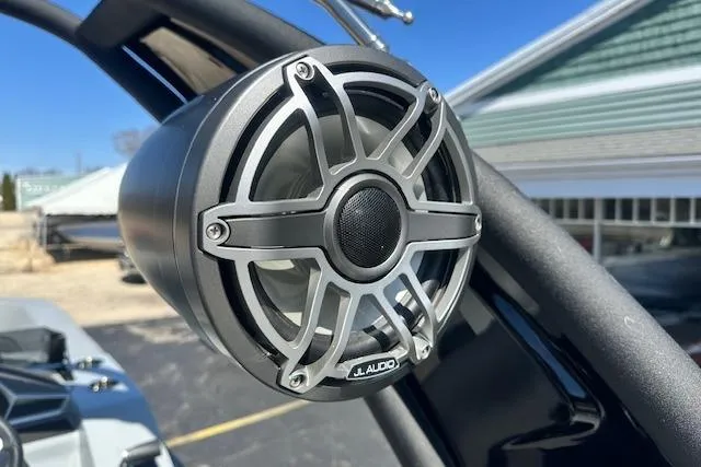 Slide: The Image of 2024 Manitou LX 25 SRS boat with JL Audio speaker system. - 19