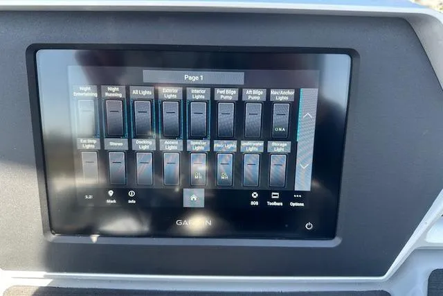 Slide: The Image of Touchscreen control panel in a 2024 Manitou LX 25 SRS boat, displaying various light and pump switches. - 25