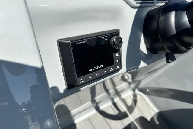 Slide: The Image of 2024 Manitou LX 25 SRS featuring JL Audio system on sleek dashboard. - 26