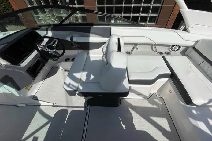 Slide: The Image of 2025 Regal LS2 Surf boat interior with sleek white seating and modern dashboard. - 5