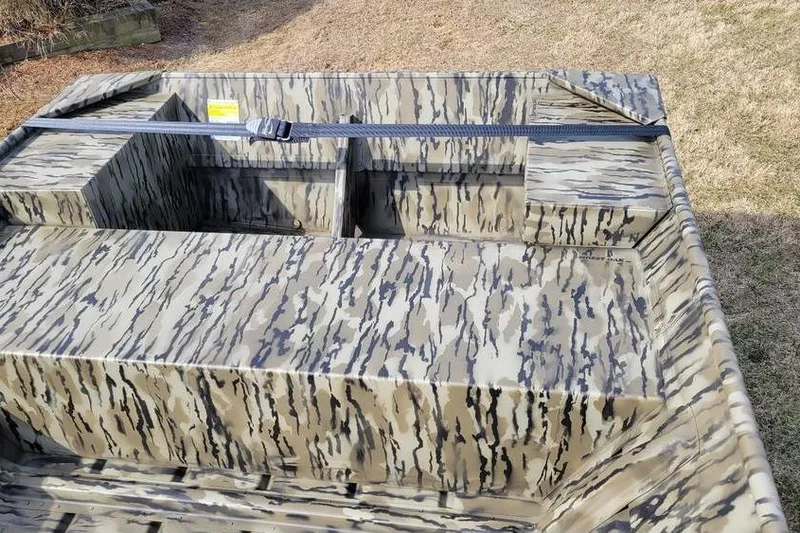 Slide: The Image of 2025 Smoker Craft 1648 jon boat with camouflage pattern, 16-foot length, 48-inch bottom width. - 3