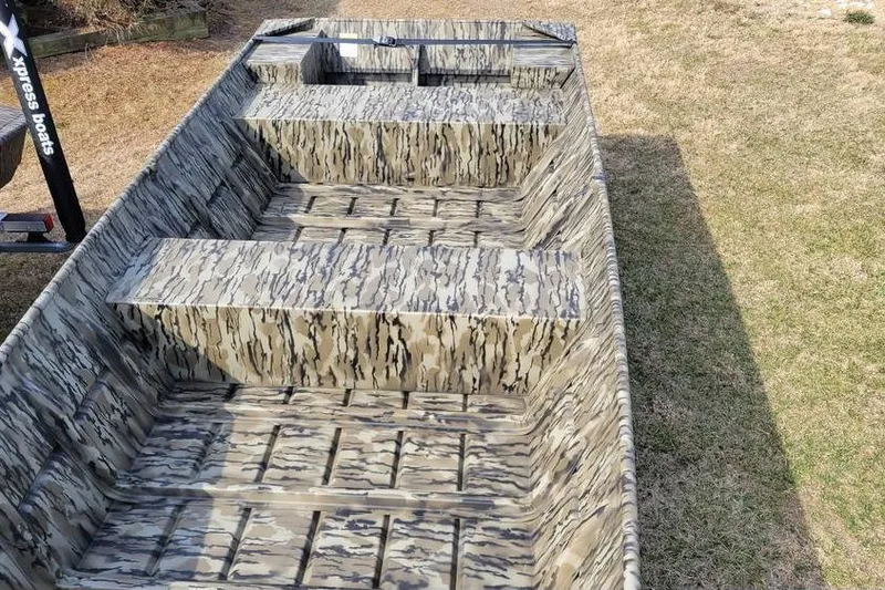 Slide: The Image of 2025 Smoker Craft 1648 jon boat with camouflage pattern, 16-foot length, 48-inch bottom width. - 4