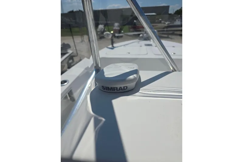 Slide: The Image of Simrad device on 2002 Rinalli 2100 boat, outdoor setting, sunny day. - 20