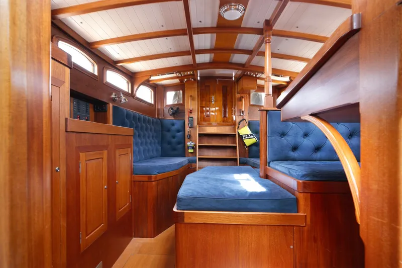 Slide: The Image of Luxurious wooden interior of 2011 Spirit 50 DH yacht with blue cushioned seating. - 13