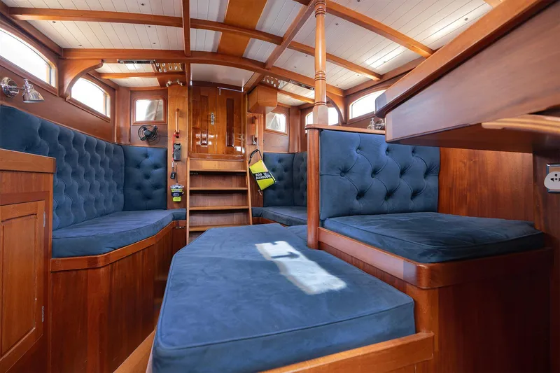 Slide: The Image of Luxurious interior of 2011 Spirit 50 DH yacht with plush blue seating and wooden finishes. - 14