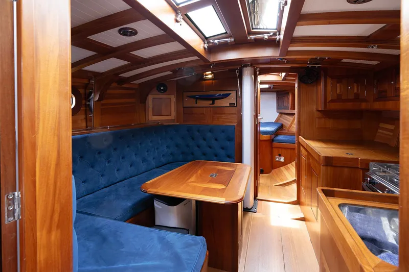 Slide: The Image of Luxurious 2011 Spirit 50 DH yacht interior with elegant wood finish and blue seating. - 15