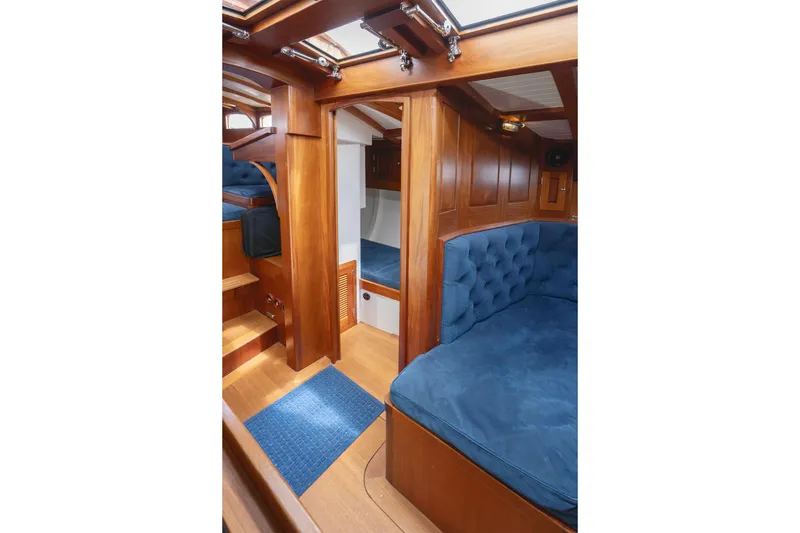 Slide: The Image of Luxurious interior of 2011 Spirit 50 DH yacht with blue upholstery and wooden finish. - 25