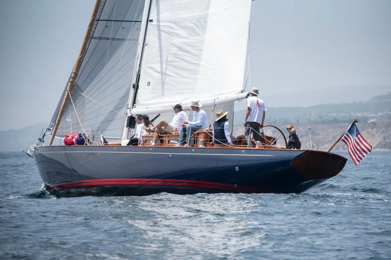 Slide: The Image of Sailing yacht Spirit 50 DH 2011 with crew on open water, American flag displayed. - 4