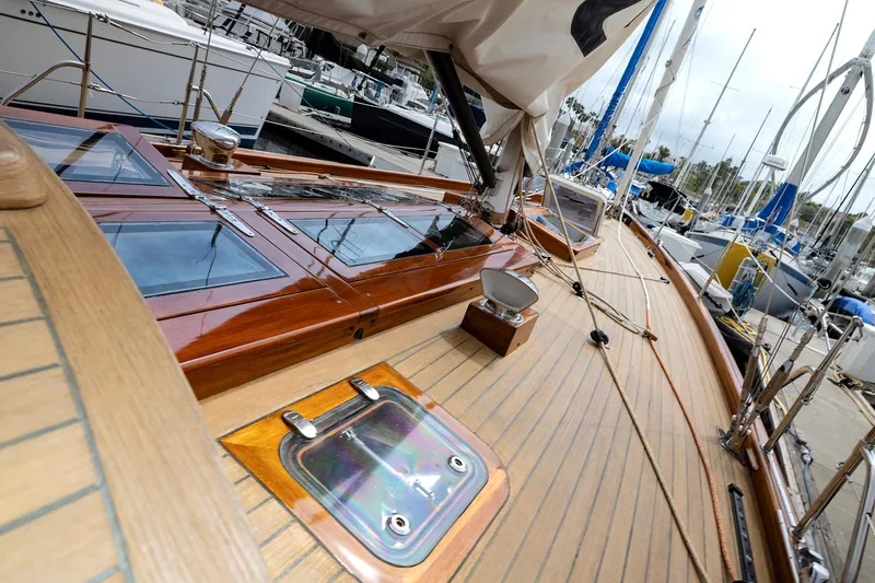 Slide: The Image of 2011 Spirit 50 DH yacht deck with polished wood finish, docked at marina. - 8