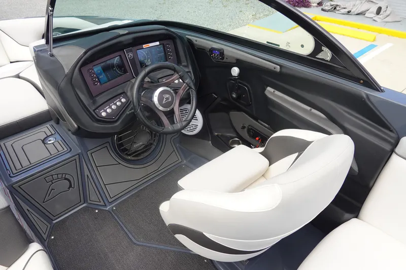 Slide: The Image of 2017 Centurion Ri217 boat interior with modern dashboard and steering wheel. - 10