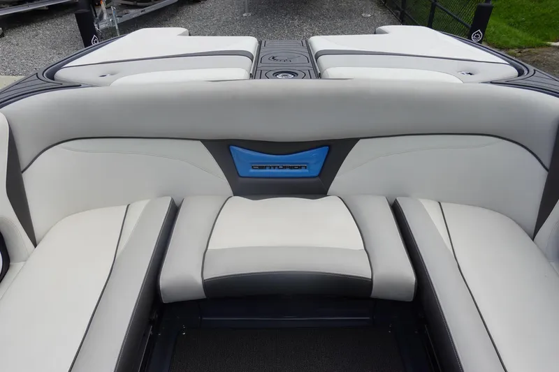 Slide: The Image of 2017 Centurion Ri217 boat interior with gray and white seating, featuring blue accent. - 16