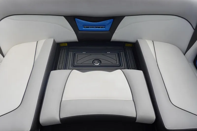 Slide: The Image of 2017 Centurion Ri217 boat interior with sleek white and black seating design. - 17