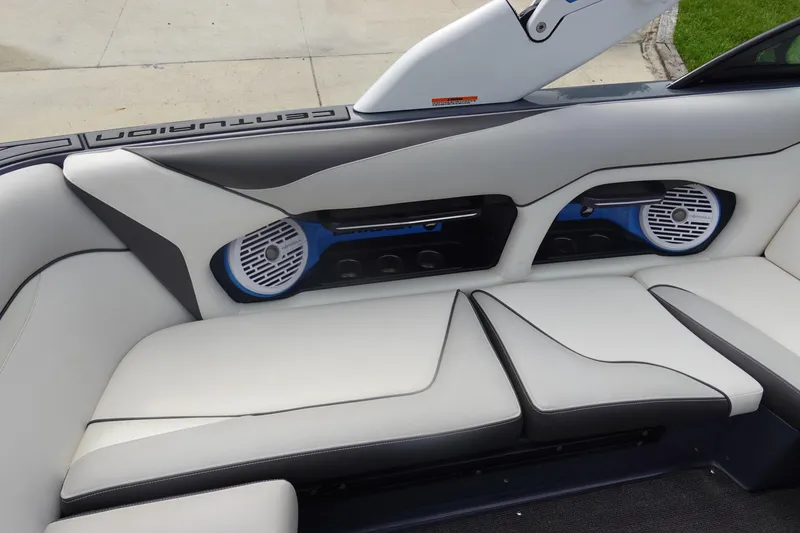 Slide: The Image of 2017 Centurion Ri217 boat interior with white seating and built-in speakers. - 18