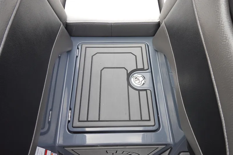 Slide: The Image of 2017 Centurion Ri217 boat storage compartment with sleek design and secure latch. - 28