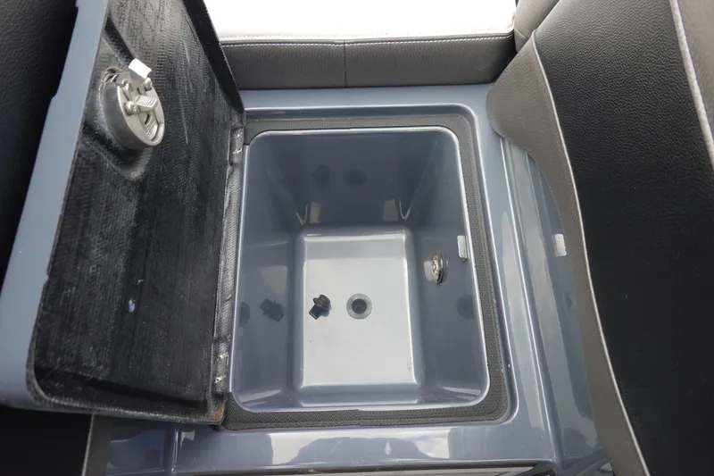 Slide: The Image of Open storage compartment in 2017 Centurion Ri217 boat interior. - 29