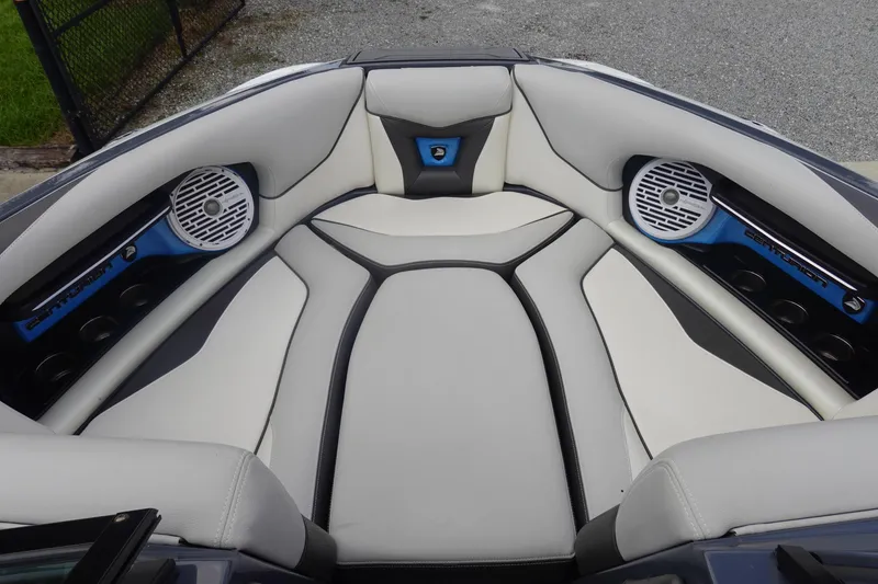 Slide: The Image of 2017 Centurion Ri217 boat interior with white seating and built-in speakers. - 30