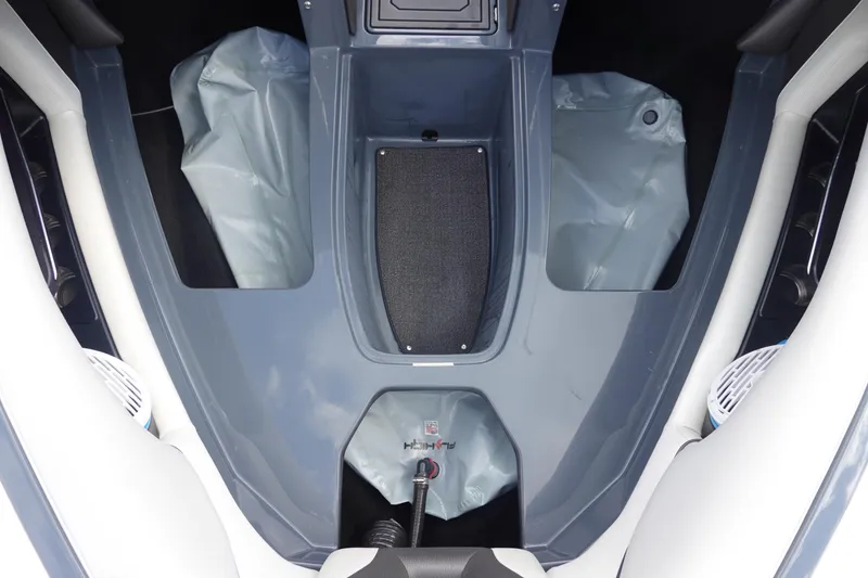 Slide: The Image of 2017 Centurion Ri217 boat interior with storage compartments and seating. - 33