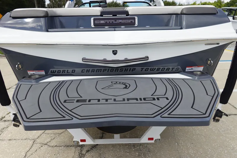 Slide: The Image of 2017 Centurion Ri217 boat rear view with branded swim platform and towboat logo. - 6