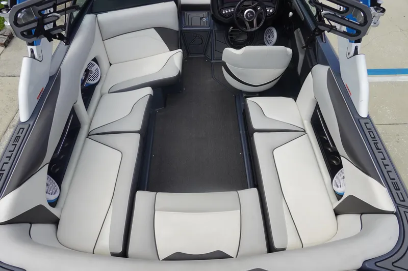 Slide: The Image of 2017 Centurion Ri217 boat interior with spacious seating and modern design. - 9