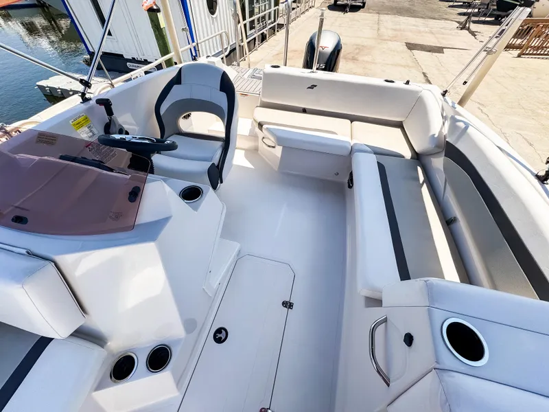 Slide: The Image of 2023 Starcraft SVX 171 OB boat interior with seating and steering console. - 11