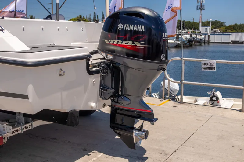 Slide: The Image of 2023 Starcraft SVX 171 OB boat with Yamaha VMAX outboard motor at a marina. - 3